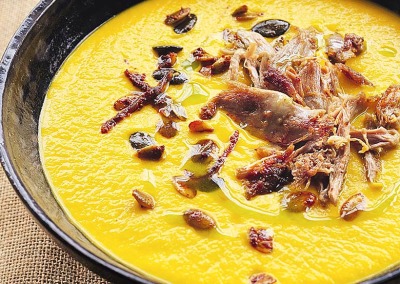Pumpkin Soup with Duck Confit & Spiced Pepitas